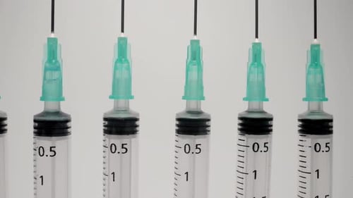 A Row of Medical Syringes