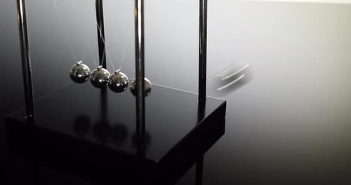 Newton's Cradle Demonstrating Conservation of Momentum