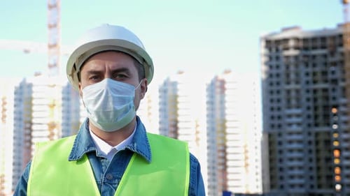 Construction Worker Wearing Mask and Safety Gear