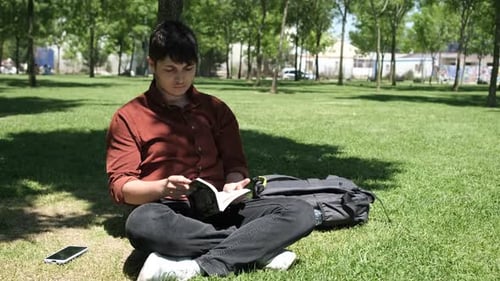 Student Working on Grass