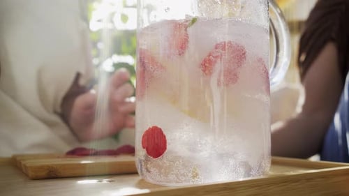 Refreshing Fruit Drink with Friends on Sunny Day