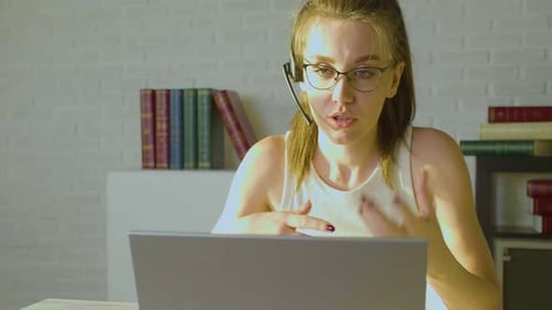 Closeup View of a Young Adult Woman Works in Front of a Laptop Monitor She Having Online Video Call