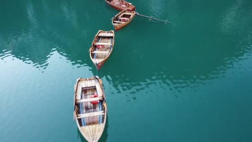 Low Angle Flight Above Boats on Lake, Aerial