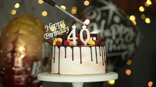 Lighting Candles on a 40th Birthday Cake