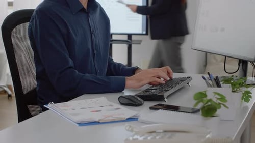 Close Up of Corporate Employee Using Keyboard and Computer
