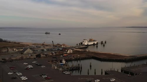 an aerial shot of the Orient Point ferry docked, as it takes on vehicles and passengers for the next