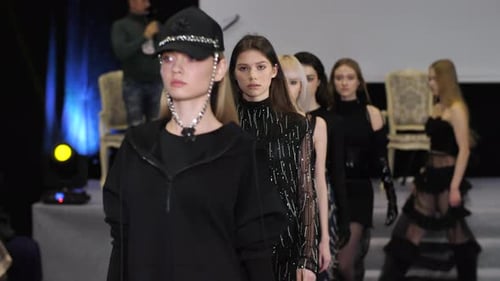 Fashion Models Strutting Down Runway During a Show