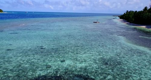 Tropical aerial abstract shot of a white sand paradise beach and aqua blue water background in colou