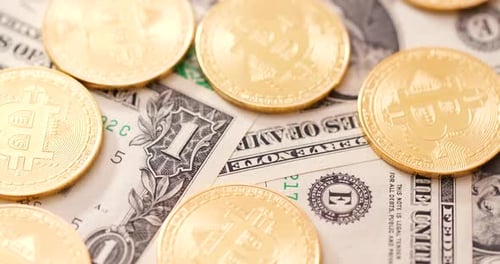 Bitcoin Coins Lying on One Dollar Bills
