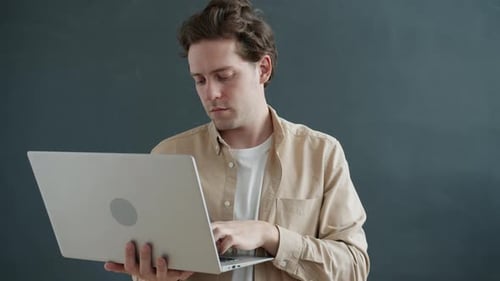 Man Using Laptop Computer, Thinking