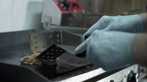 Cooking Meat on Grill, Male Cook Hands in Gloves Turns Juicy Slices of Meat While Frying Background