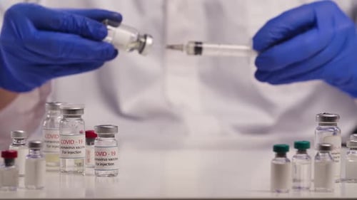 Vials with Flu and Coronavirus Vaccine