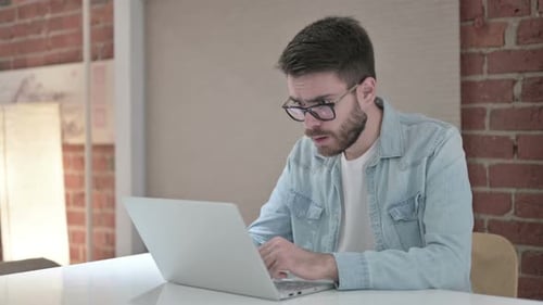 Shocked Young Male Designer Reacting To Failure