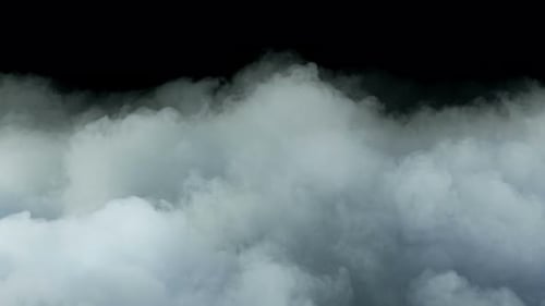 Light Gray Smoke Billows Across Black Background