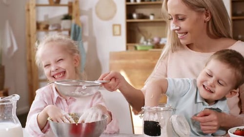 Happy Caucasian Housewife Making Batter with Kids