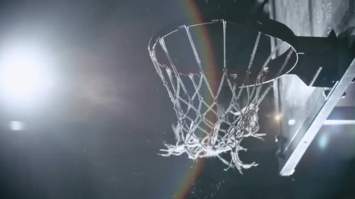Basketball Swishes Through Net At Night