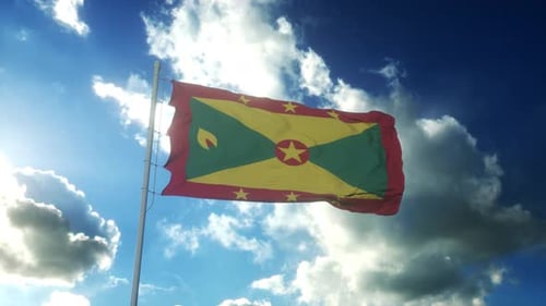 Grenada Flag Waving Against Blue Sky