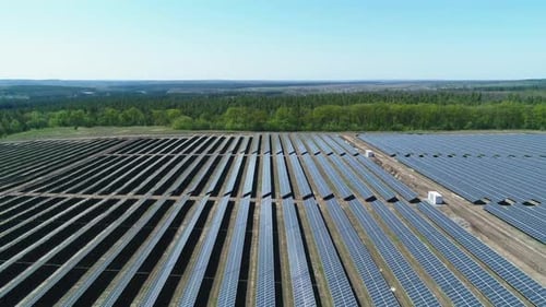 Aerial View of Solar Power Station Field at Sunny Day. Aerial Top View of Solar Farm. Renewable