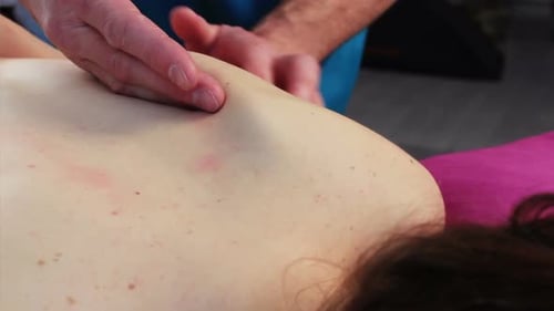 Woman Receives Shoulder Massage for Muscle Relaxation