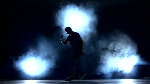 One Hip Hop Break-dancer Stylish Man in Sunglasses Dancing, Smoke, Silhouette