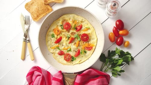 Delicious Omelet with Tomatoes in Pan Top View