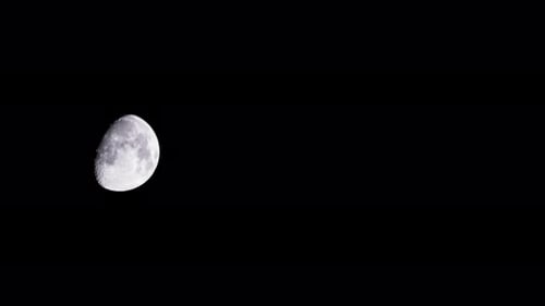 Close Up of a Half Moon in Space