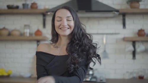 Woman Smiles, Posing in Kitchen