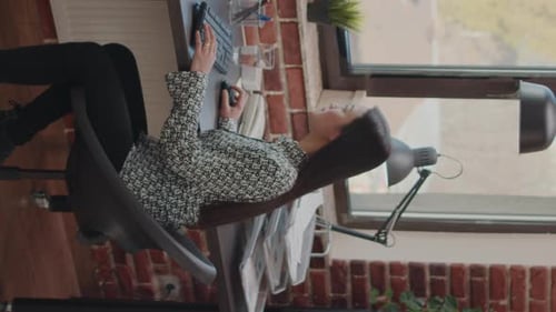 Woman Working at Computer, Expressing Joy in Office