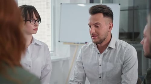Emotional Man at Group Meeting Receives Consolation