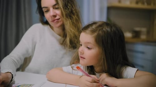 Mother and Child Drawing Together Indoors