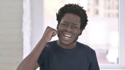 Portrait of African Man Getting Angry in Office