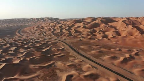 Aerial Of Road In Desert Dunes