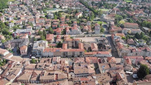 Aerial Moving View of Small Cosy Italian City in Province, Camera Is Flying Over Roofs of Old