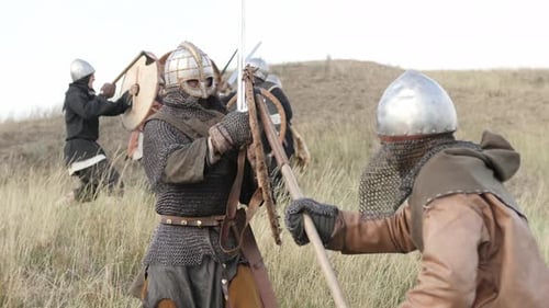 Warriors Fighting with Swords and Axes on Hill