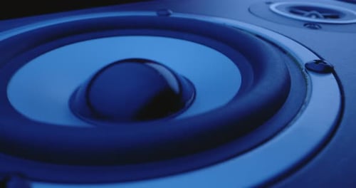 Speaker Vibrating Under Blue Lighting