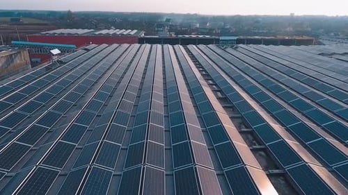 Factory roof with solar panels. Aerial view of the solar energy on rooftop