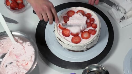Hand Decorating Strawberry Cake with Cream