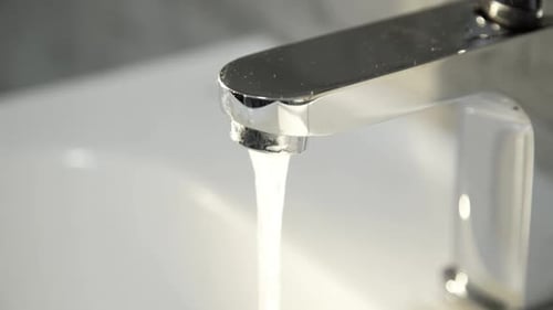 Close View of Hands Washing Them Under Steam of Water in Faucer