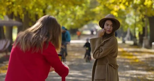 Woman Posing for Photograph in Autumn Park