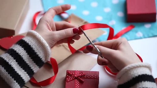 Wrapping Gifts and Cutting a Red Ribbon