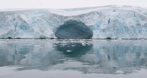 MS Glacier and ice floes on water at Torgersen Island / Antarctic Peninsula, Antarctica