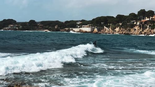 Surfer Riding, Turning with Spray on Blue Ocean Wave and Falling in Water, Surfing Ocean Lifestyle
