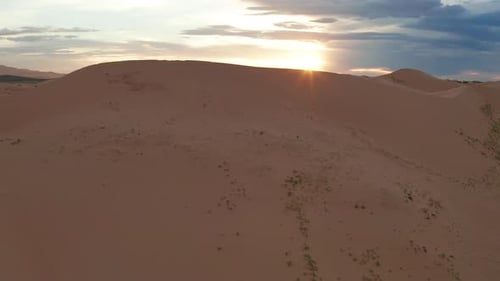 Sunset Over the Sand Dunes in the Desert