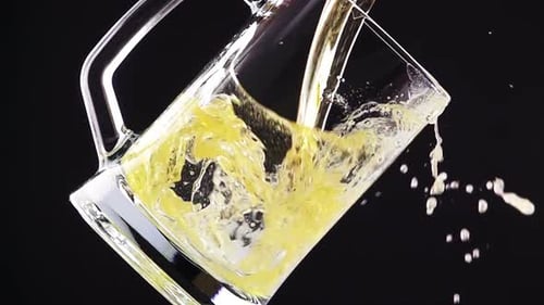 Craft Beer Pouring into Glass Mug in Slow Motion