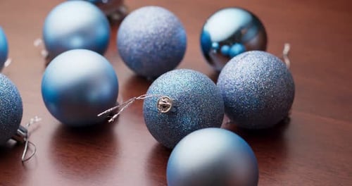 Shiny Christmas Balls on Wooden Surface