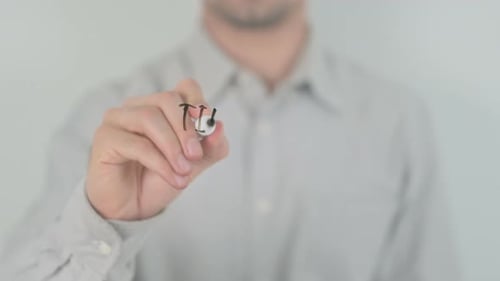 Man Writes Time to Update with Marker