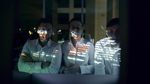 Cyber Security Team Working in Office at Night