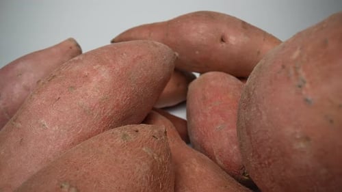 Fresh Sweet Potatoes on a White Background