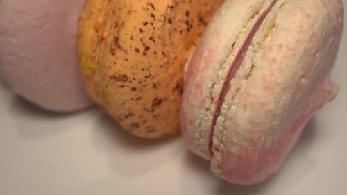 Close-up of Multi-Colored Macarons on White Background