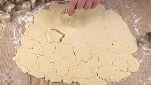 Cutting Christmas Cookie Dough with Cookie Cutters